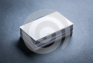 Blank white business card on grey background