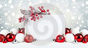 Blank White Christmas Sign with Red Ornaments in Snow, Winter Holiday Background