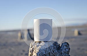 Blank white coffee mug on a old pier wasteland