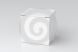 Blank white cube gift box with closed hinged flap lid on white background. Clipping path around box mock up.