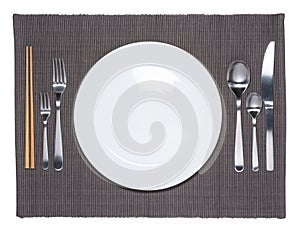 Blank white dish, fork, spoon, knife and chopsticks