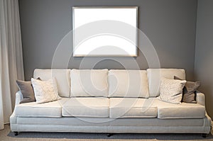 Blank white empty mock up template of a picture/art work with metal frame on living room/lounge wall