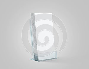 Blank white flyers stack mockup in glass plastic holder, photo