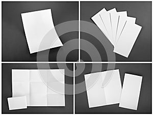 Blank white folding paper flyer on gray background