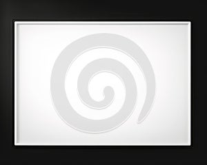a blank white frame on a black wall