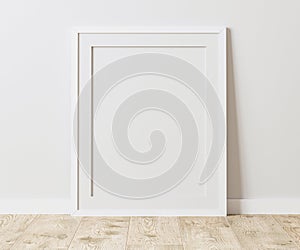 Blank white frame with mat on wooden floor with white wall, 4:5 ratio - 40x50 cm, 16 x 20 inches, poster frame mock up, 3d renderi