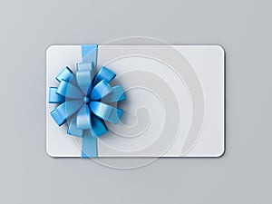 Blank white gift card with blue ribbon bow or gift voucher on gray background with shadow minimal concept 3D rendering