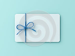 Blank white gift card with blue ribbon rope bow on blue cyan pastel color background with shadow minimal concept 3D