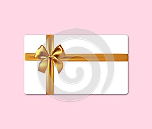 Blank white gift card with realistic gold ribbon bow