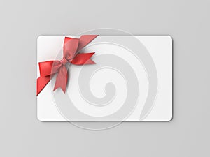 Blank white gift card with red ribbon bow on grey background with shadow minimal conceptual 3D rendering