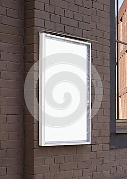 Blank white glass rectangular poster mockup brick wall mounted