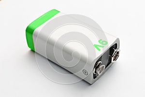 Blank white and green 9v battery on white background