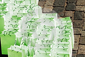 Blank white green paper bag for taking away food or shopping pavement roadway street