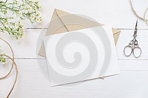 Blank white greeting card with brown envelop