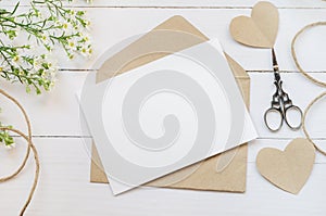 Blank white greeting card with brown envelop