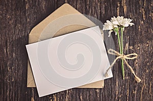 Blank white greeting card with brown envelope
