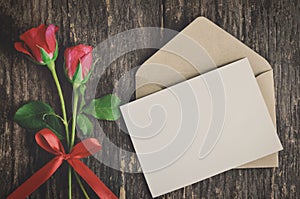 Blank white greeting card with red rose