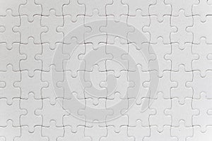 Blank white jigsaw puzzle pieces completed