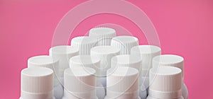 Blank white lids of spray cans for branding on pink background.