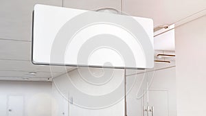 Blank white light signage mockup hanging on ceiling, clipping path