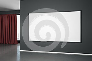 Blank white mock up poster on black wall in modern empty room with concrete floor and red curtain