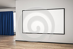 Blank white mock up poster on white wall in spacious empty room with wooden floor and blue curtain