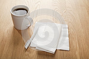 Blank White Napkin or Serviette and Pen and Coffee