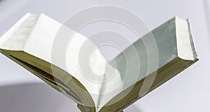 Blank white open book on a uniform backgroundblank white open book