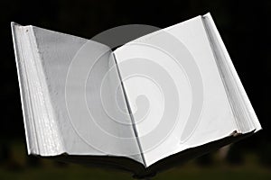 Blank white open book on a uniform backgroundblank white open book