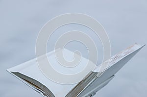 Blank white open book on a uniform backgroundblank white open book