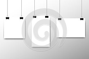 Blank white page hanging against grey background. Affiche, paper sheet hanging on a clip. Vector advertising banner mockup stand