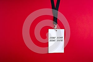 Blank white paper bagde on red background, lanyard photo
