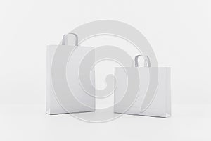 Blank white paper bags with a space for your logo. Mockup