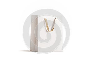 Blank white paper gift bag with gold silk handle mockup,