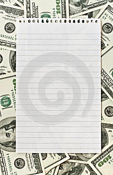 Blank white paper over money background