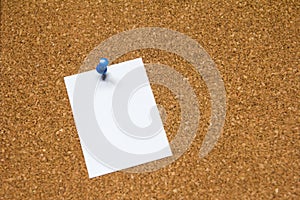 Blank white paper pin on cork board background for remind, to do list or news bulletin