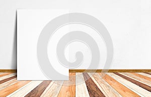 Blank white paper poster at tropical plank wooden floor and whit