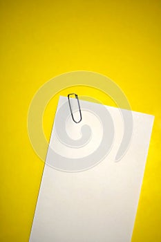 Blank white paper with staple