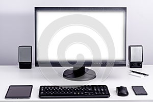 Blank white pc monitor on desktop