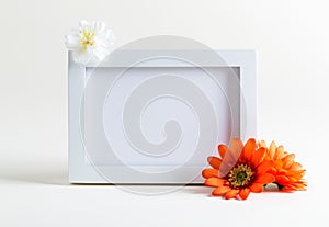 Blank white picture frame with flowers