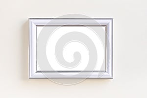 Blank white picture frame on a plain beige background.