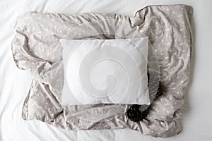 Blank White Pillow Mockup On a Grey Patterned Duvet Background With Pine Cones