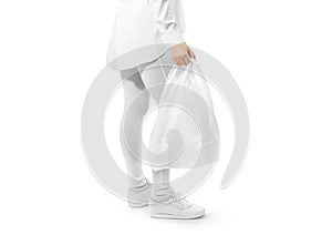 Blank white plastic bag mockup holding hand