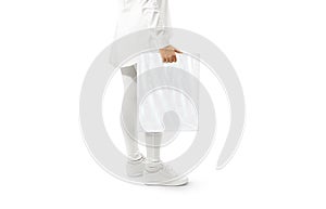 Blank white plastic bag mockup holding hand.