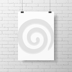 Blank white poster on brick wall