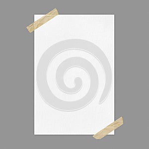 Blank white poster mockup on gray background with adhesive tape