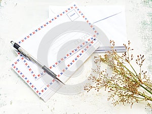 Blank white realistic envelopes with pen.