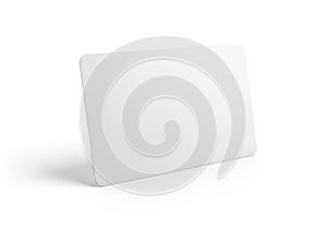 A blank white rectangular card standing upright with a subtle shadow isolated on white background