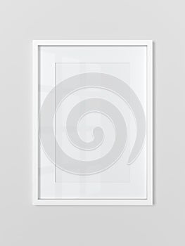 Blank white rectangular photo frame on light gray wall. Vertical.
