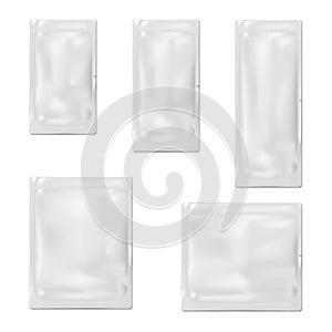 Blank white sachet packet with single tear notch. Vector mock-up set. Plastic or foil pouch bag. Food, medical or cosmetic product